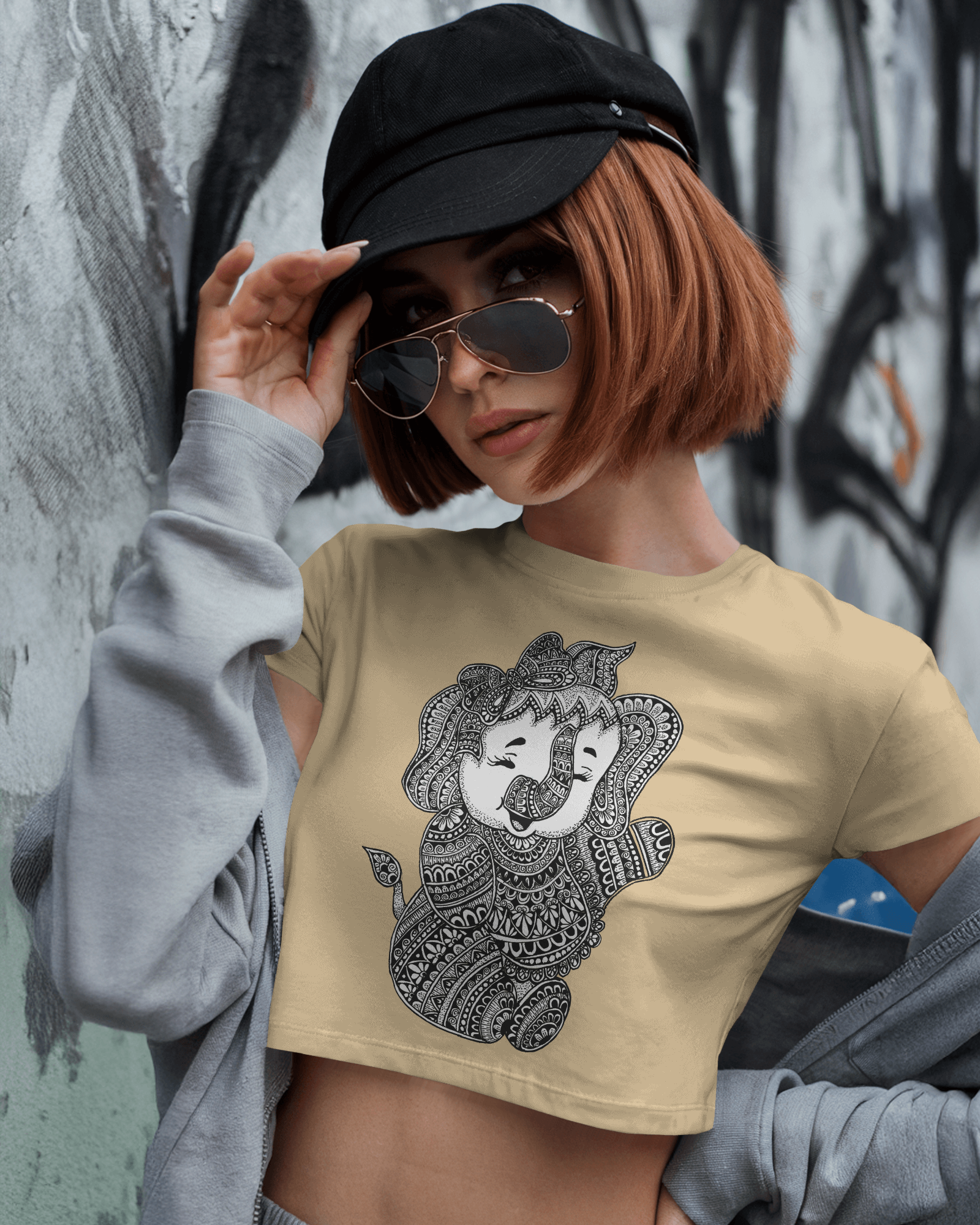 Woman wearing beige crop top with mandala Baby Ganesha illustration – Tanabana A Manoram.