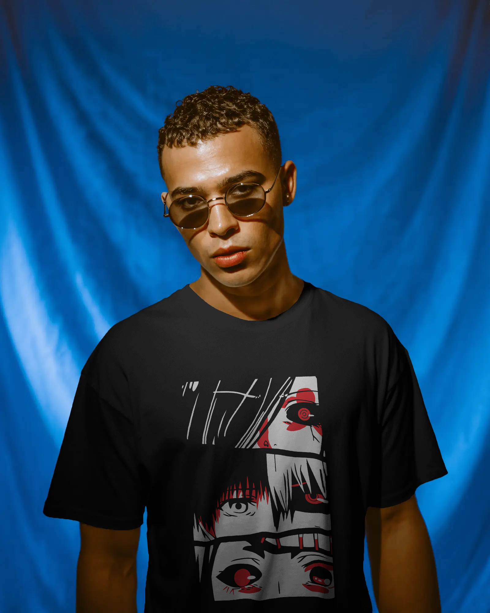 oversized T-shirt with intense anime-style eye artwork worn by a man – Tanabana A Manoram.