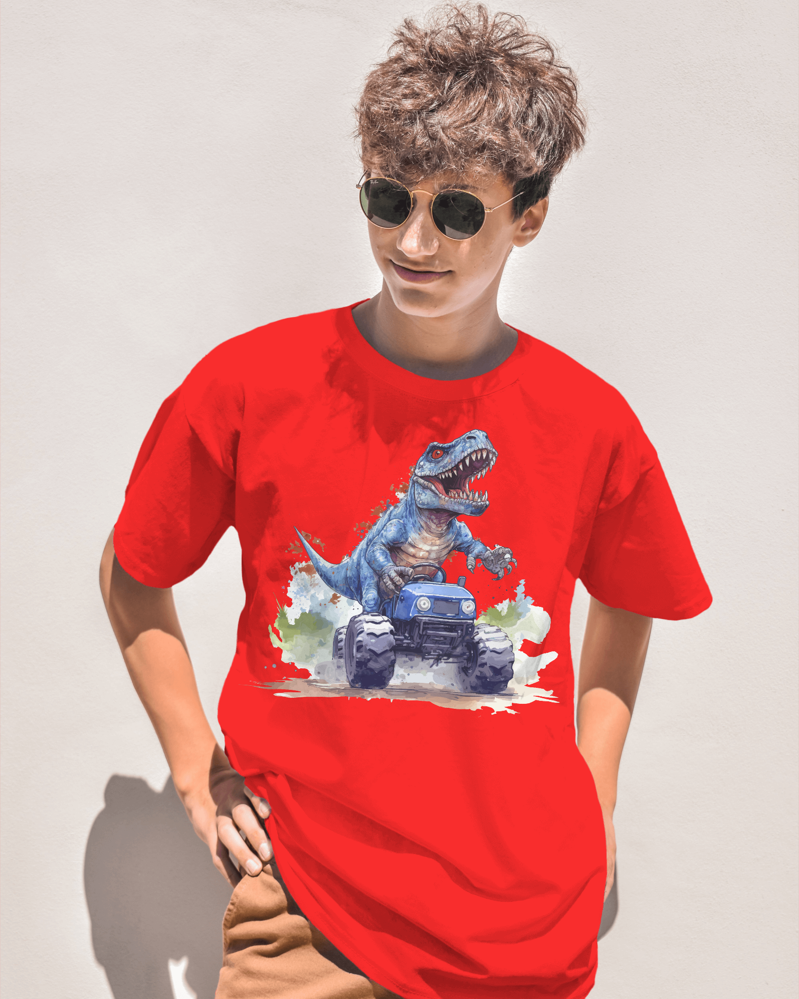 Person wearing a red t-shirt with a dinosaur graphic on a plain background