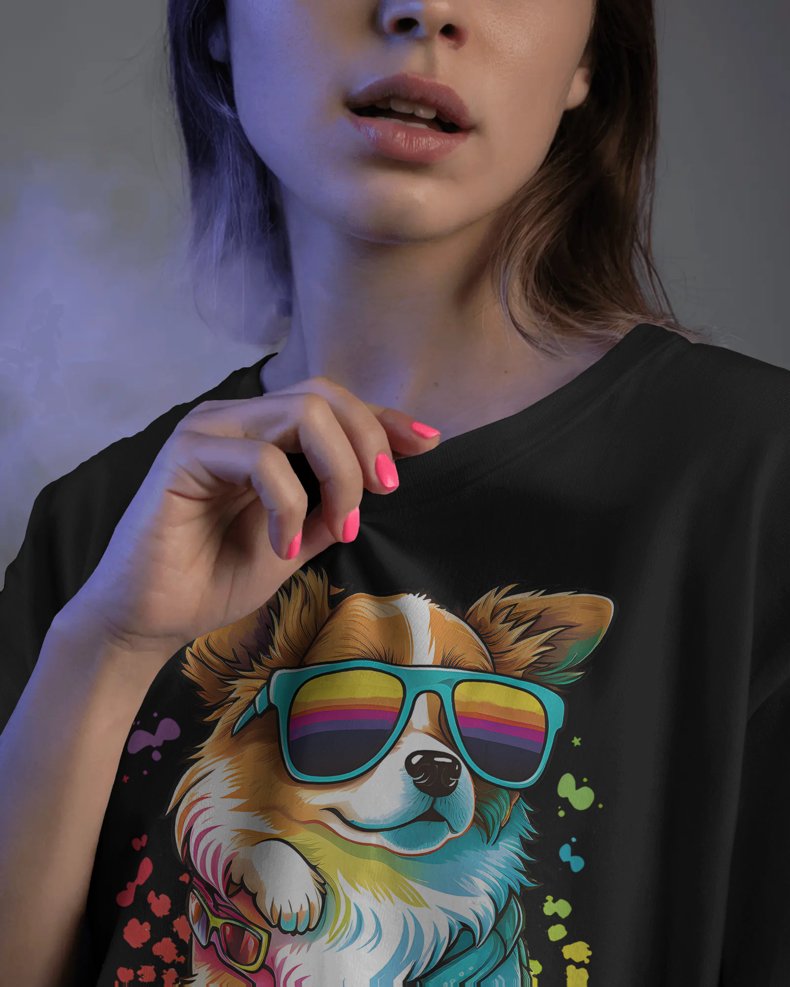 Person wearing a black t-shirt with a colorful dog graphic and rainbow sunglasses.