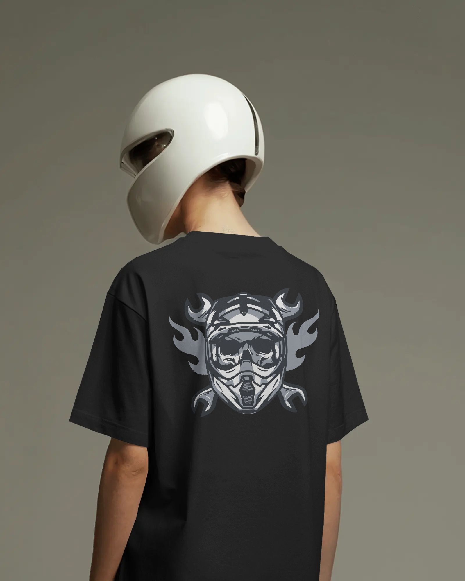 Person wearing a black t-shirt with a graphic design on the back, standing against a plain background.