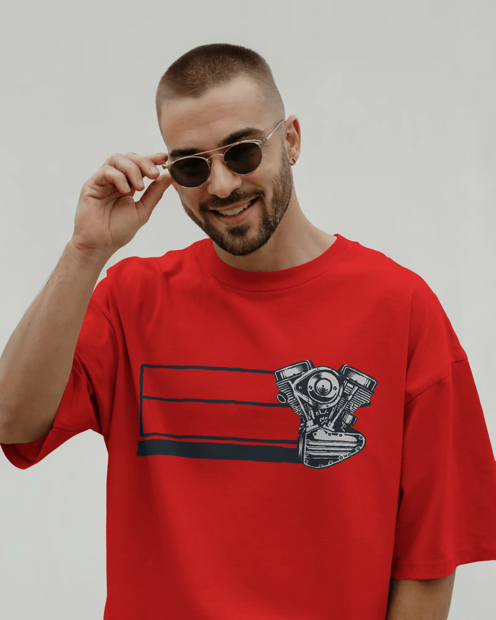 oversized t-shirt with motorcycle engine graphic print worn in streetwear style