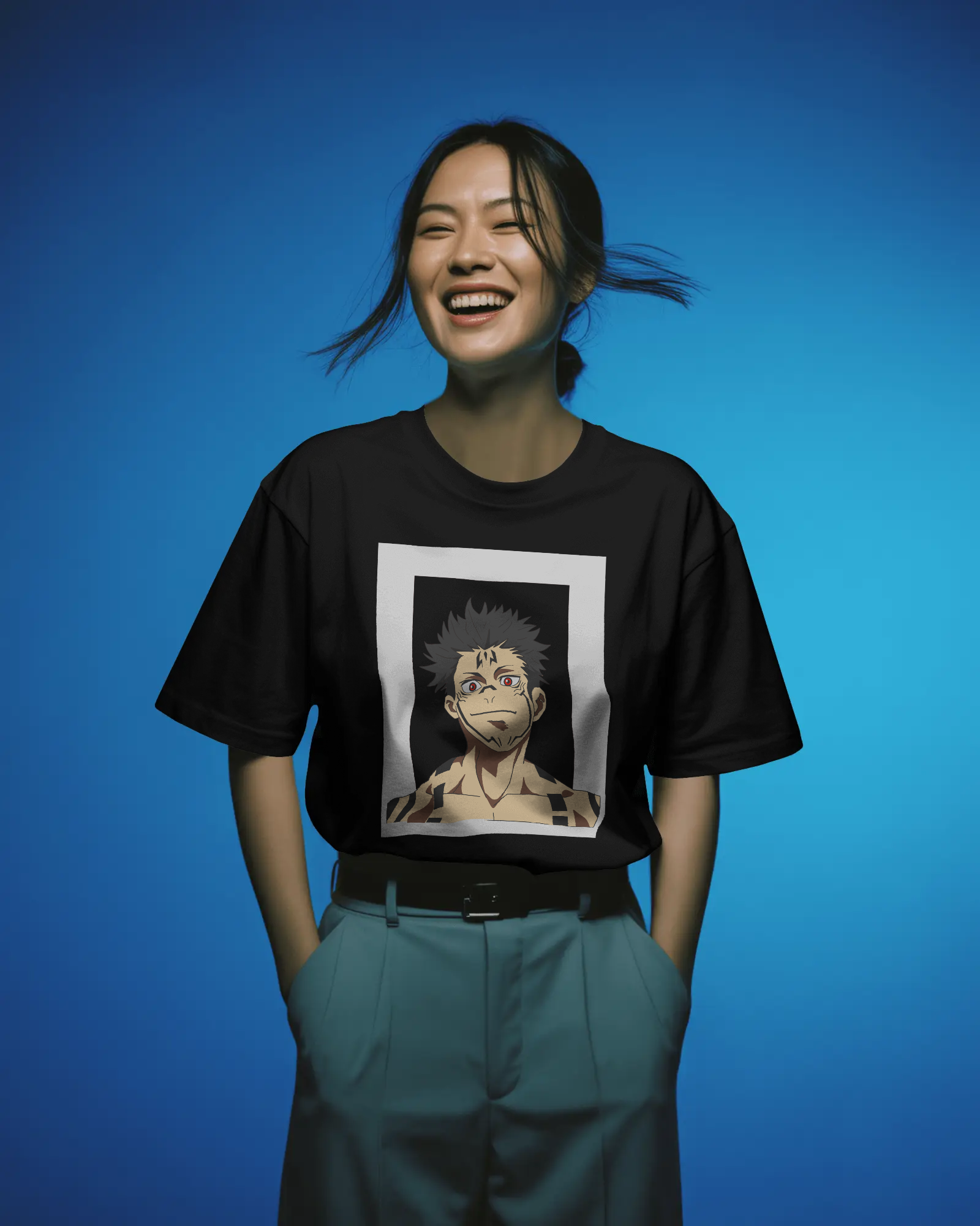 Person wearing a black t-shirt with an anime character graphic on a blue background