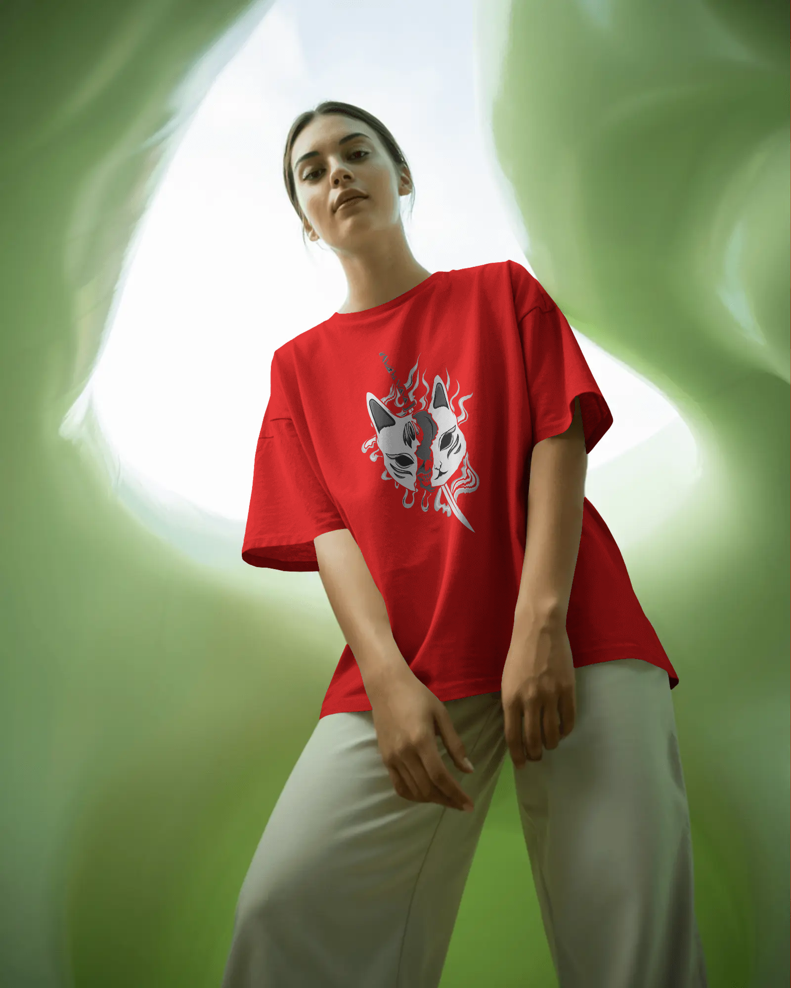 Person wearing a red t-shirt with a graphic design against a green background