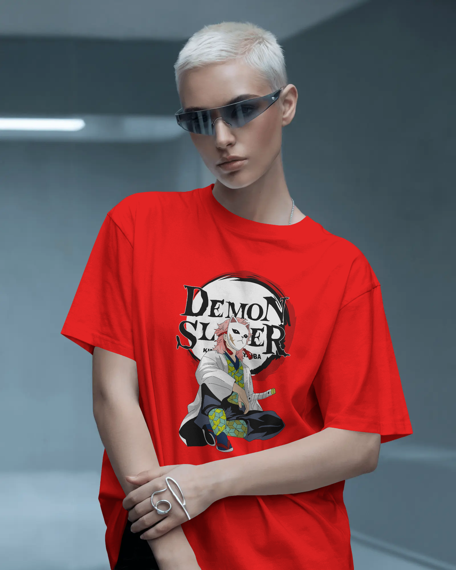Person wearing a red 'Demon Slayer' t-shirt with a character design on a gray background
