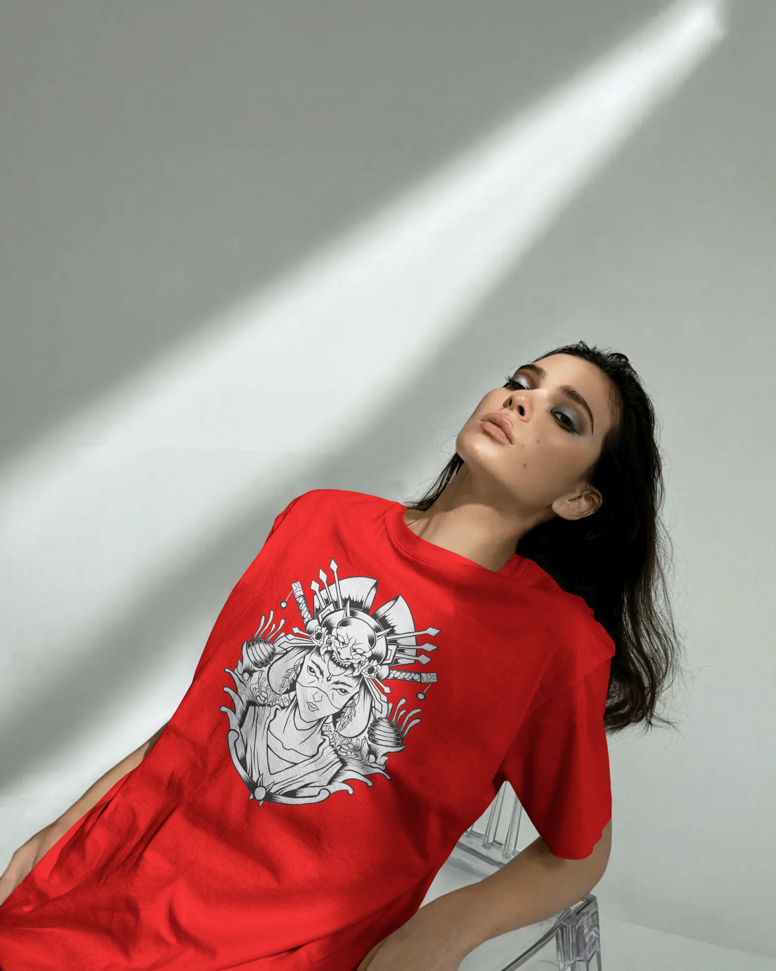 Person wearing a red t-shirt with a graphic design on a white background