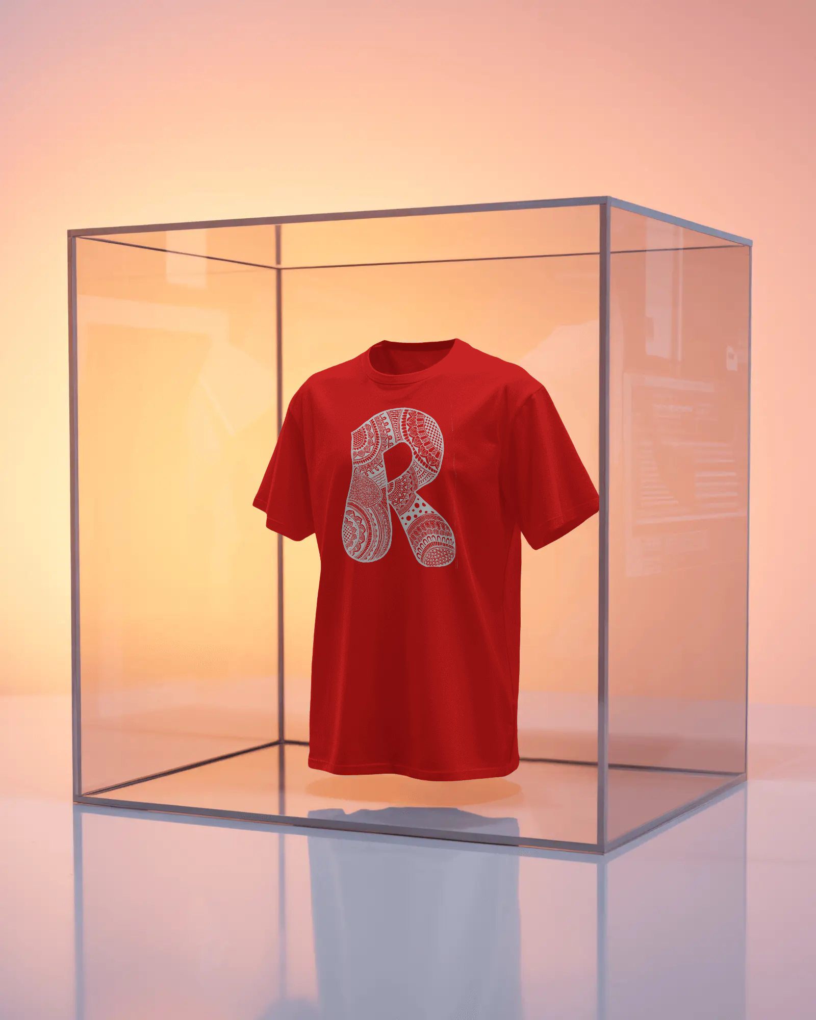 Red t-shirt with a white logo in a clear glass box on a gradient background