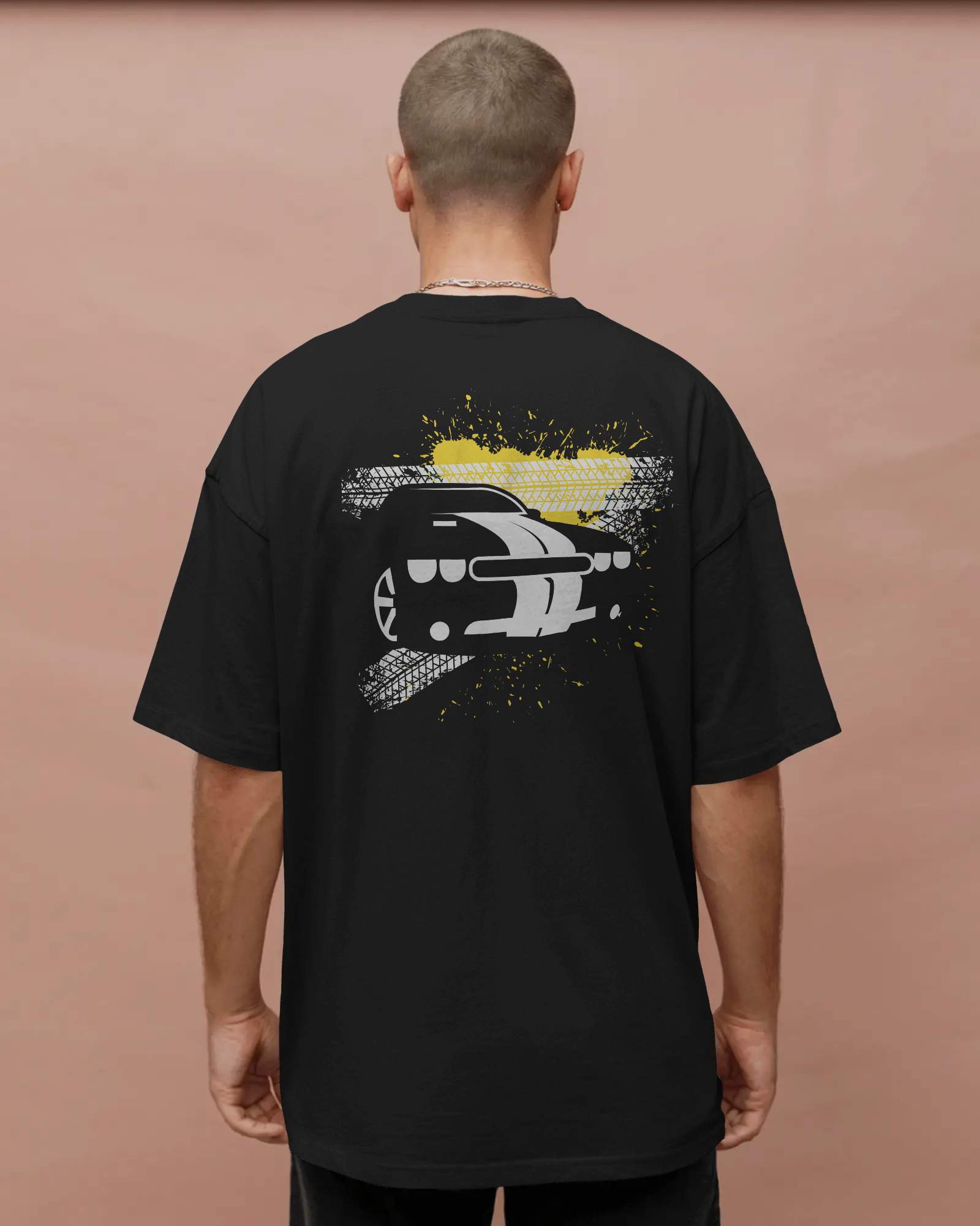 Black oversized t-shirt with car graphic back print worn in streetwear style