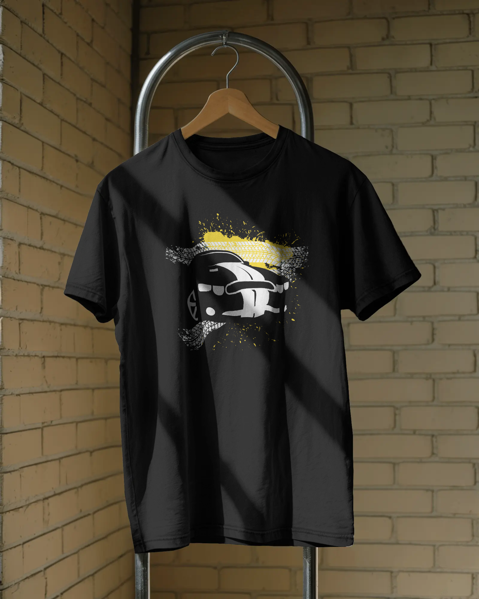 Black oversized t-shirt with car graphic front print worn in streetwear style