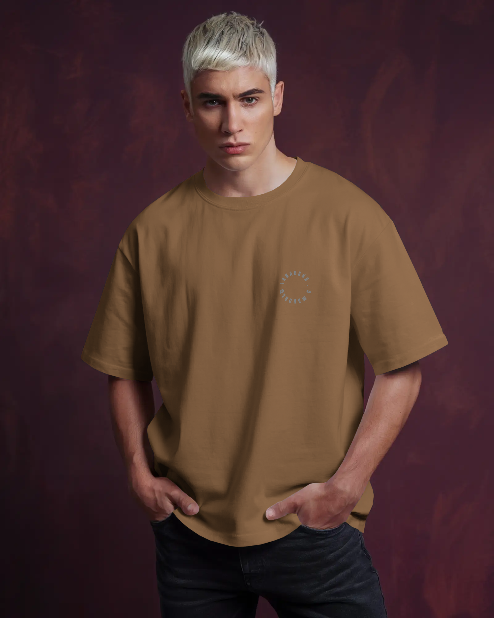 Man wearing a brown t-shirt against a dark purple background by Tanabana A Manoram