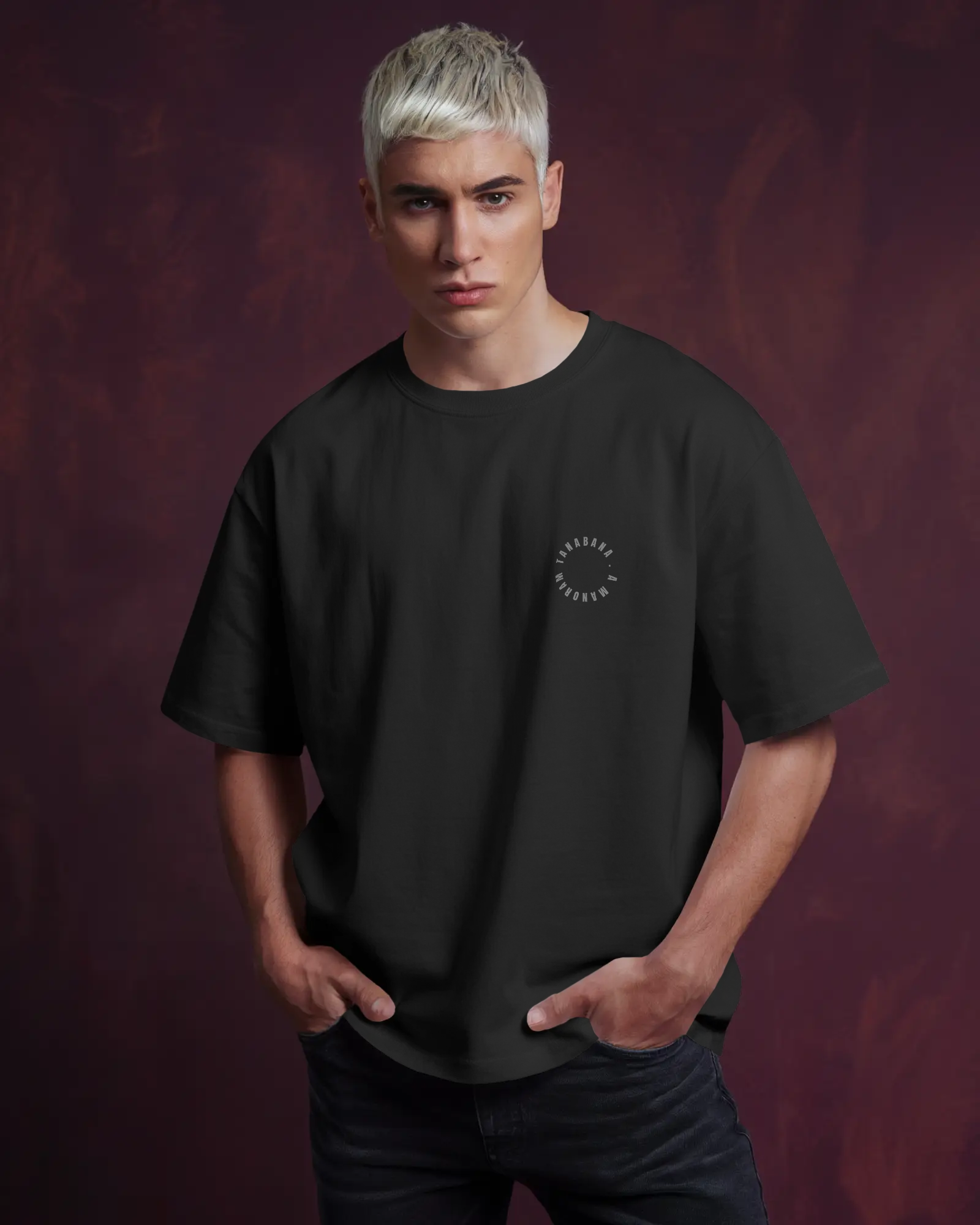 Man wearing a black t-shirt with a logo against a dark purple background by Tanabana A Manoram