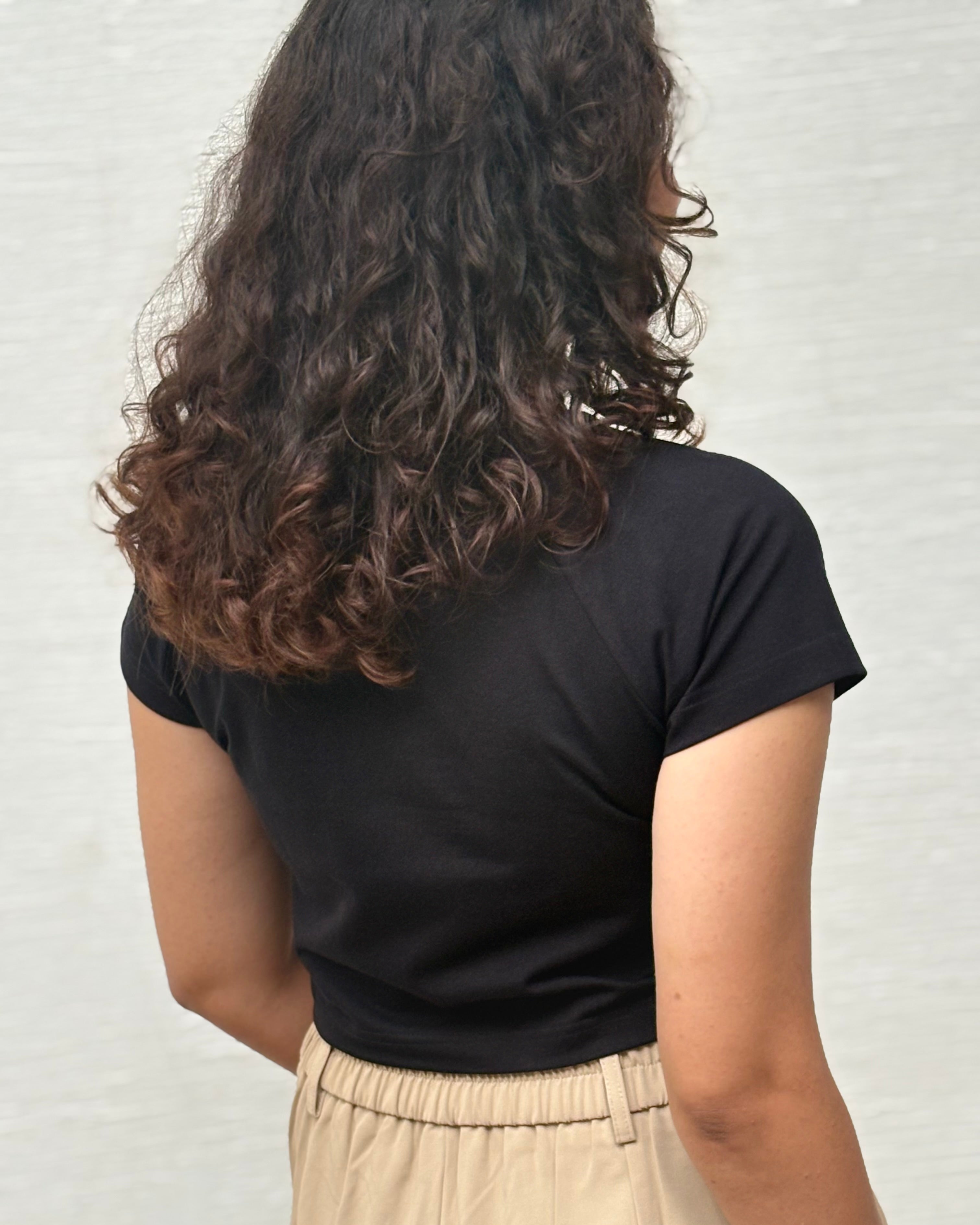 Sukoon black crop top side profile view