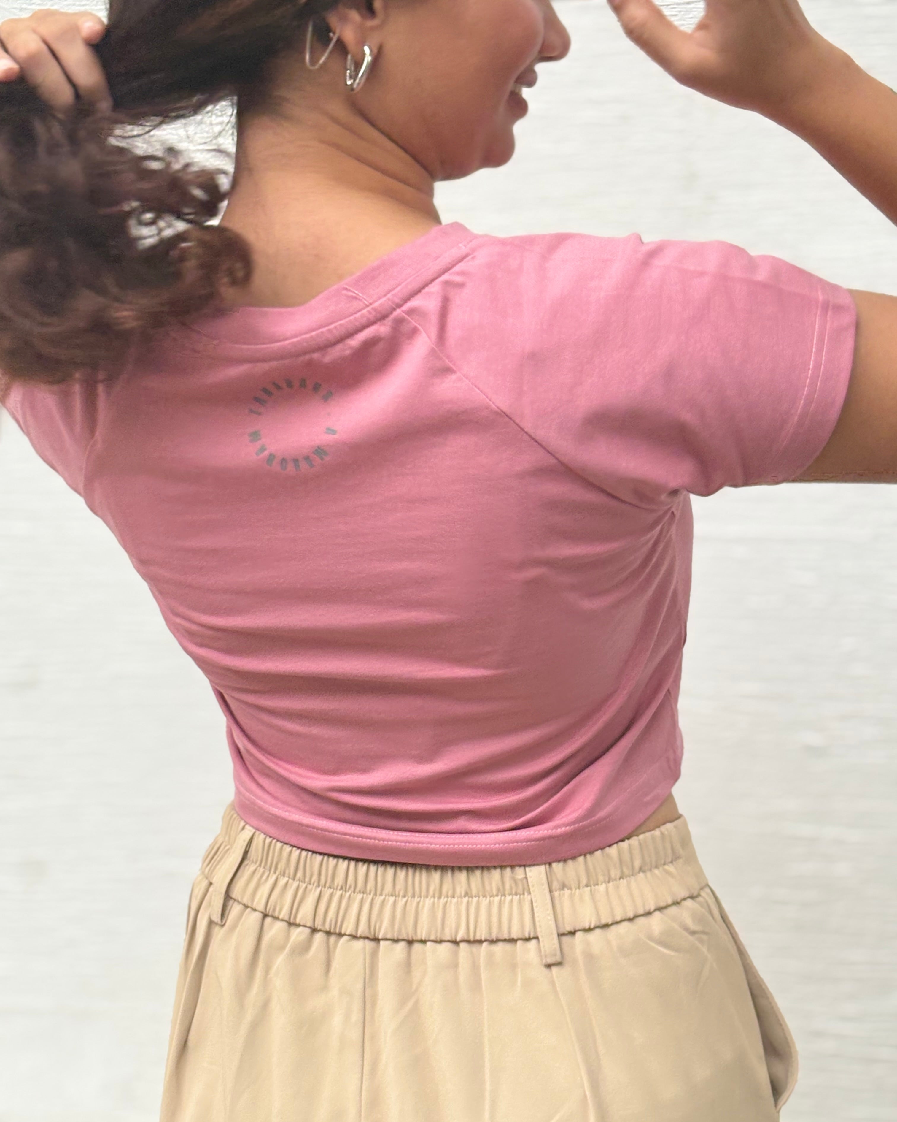 Sukoon pink crop top side profile view