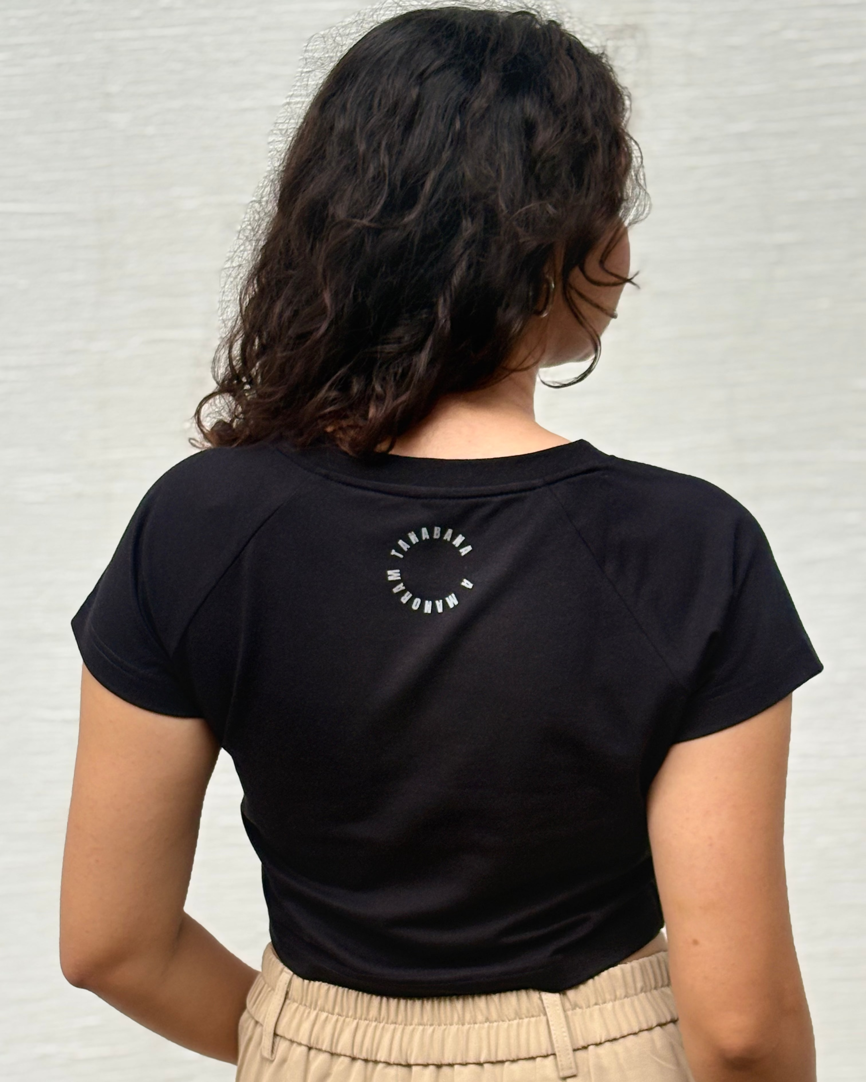 Back view of solid black color croptop