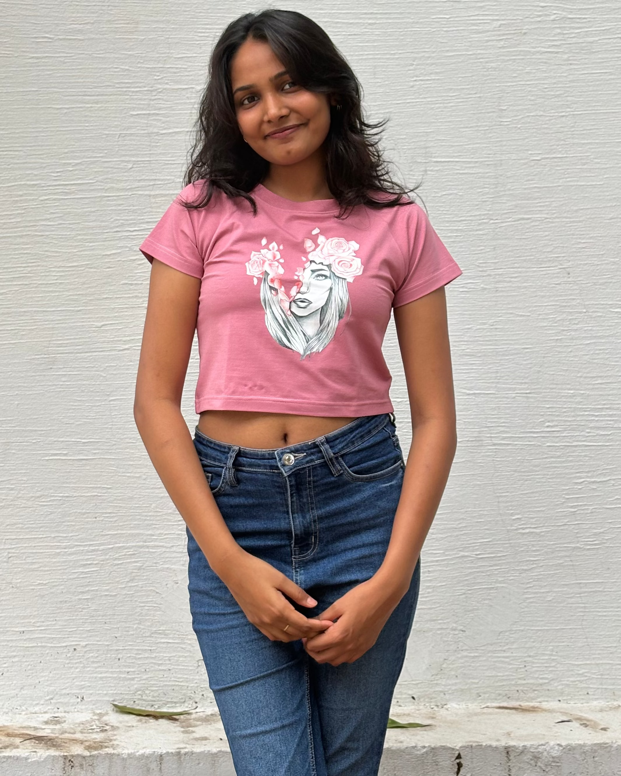 Sketched girl with roses in her hair and falling coral petals, front view onion t-shirt worn by model - Tanabana A Manoram