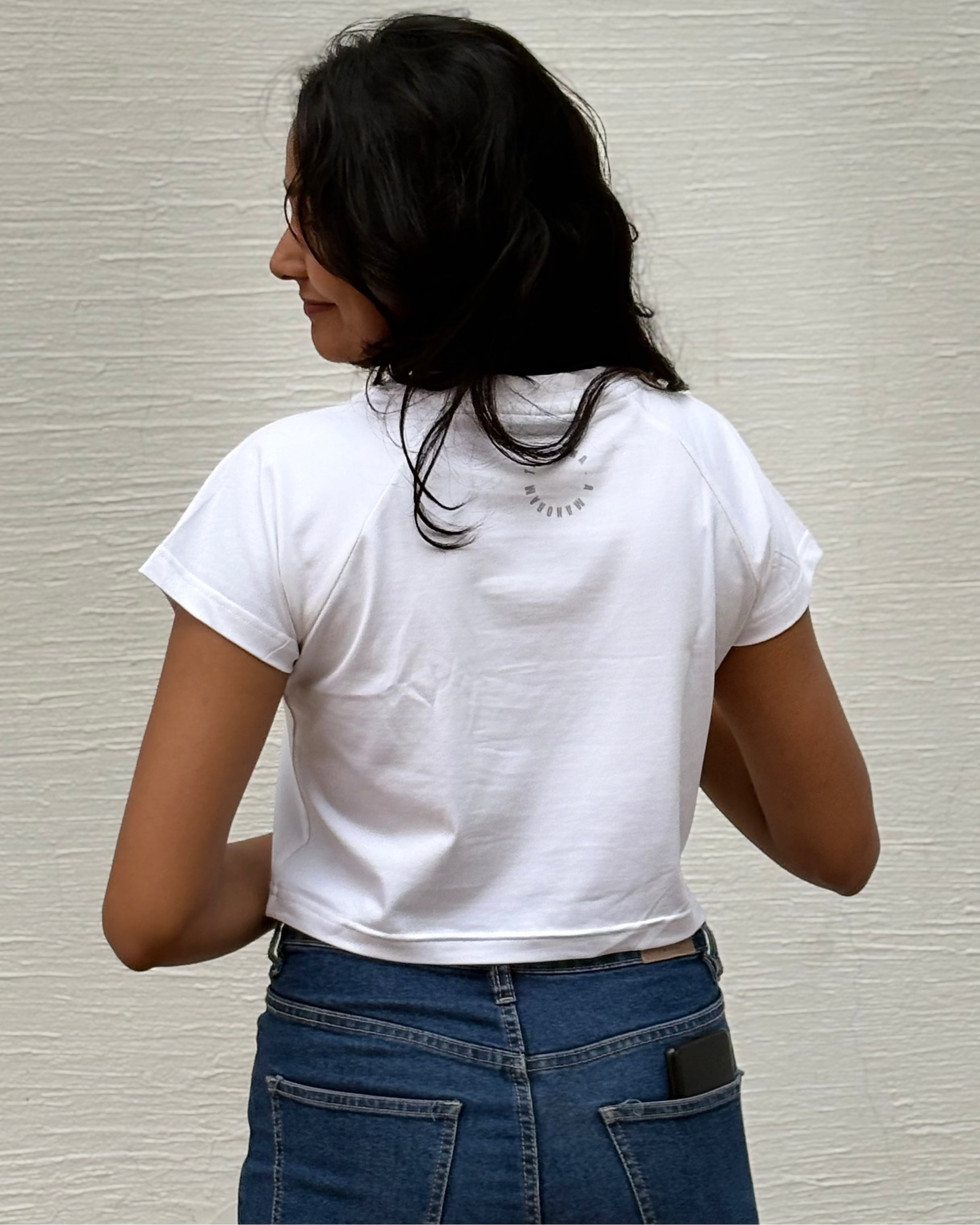 Sketched girl with roses in her hair and falling coral petals, back view white t-shirt worn by model - Tanabana A Manoram