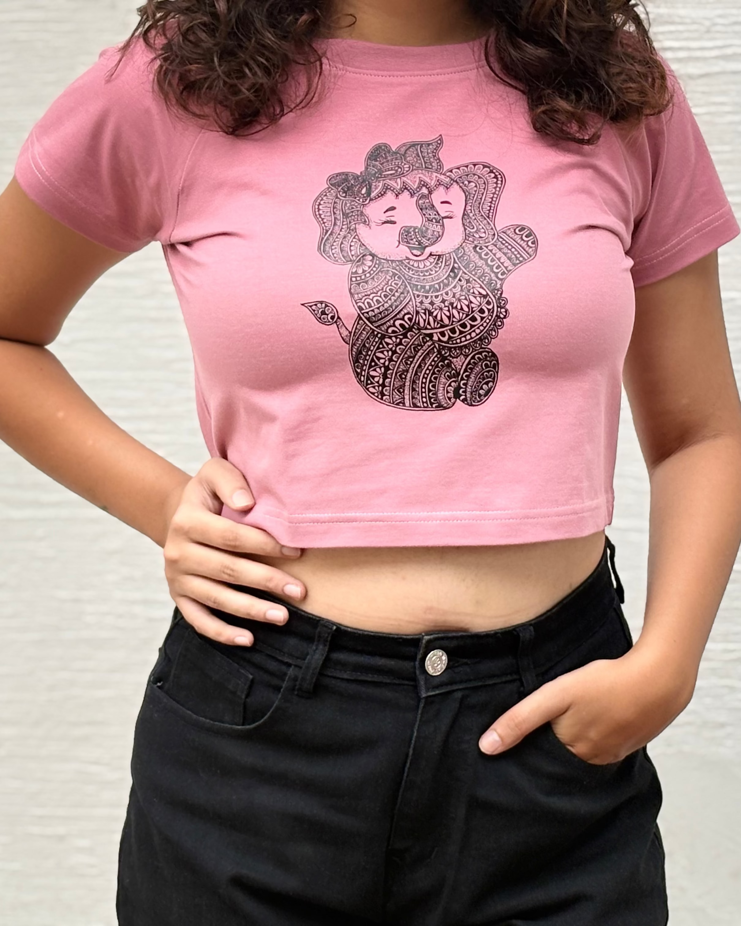 Close-up of hand-drawn mandala Baby Ganesha illustration print on t-shirt fabric - Tanabana A Manoram