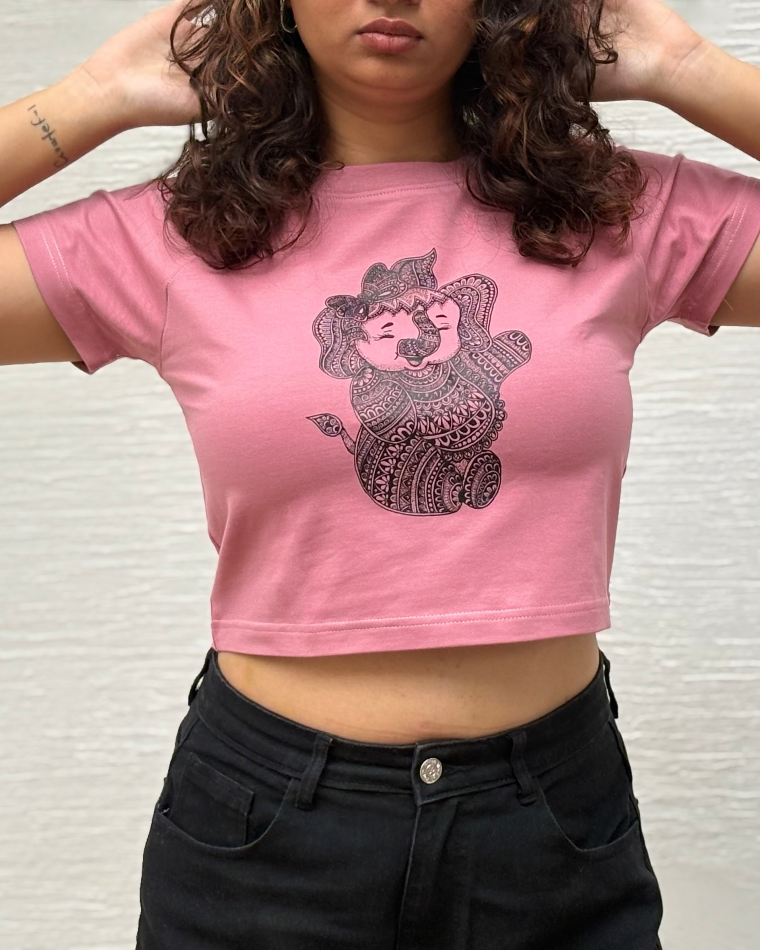 Hand-drawn mandala Baby Ganesha illustration print, side view t-shirt worn by model - Tanabana A Manoram