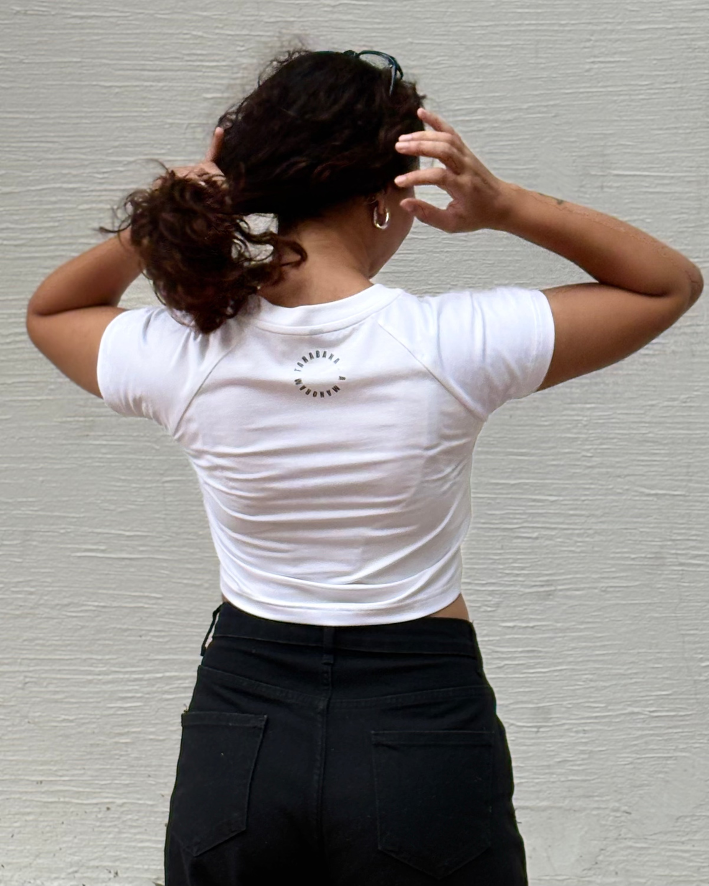Hand-drawn mandala Baby Ganesha illustration print, back view white t-shirt worn by model - Tanabana A Manoram